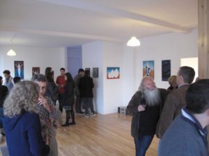 people talking in an exhibition