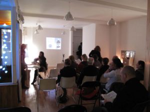 group of people watching a projected presentation