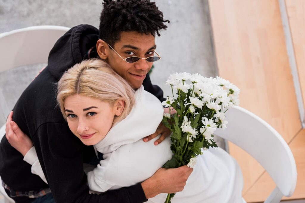 young interracial couple hugging each other