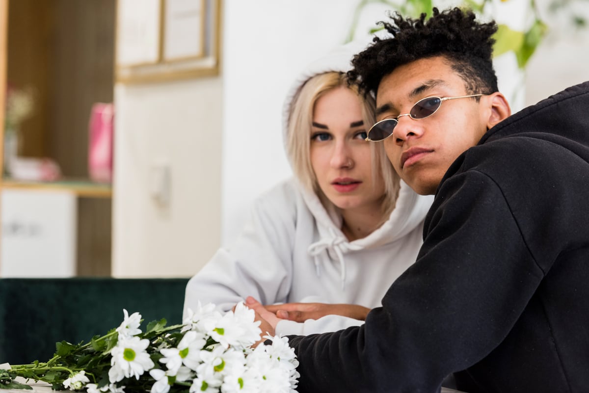 young married couple looking at the camera