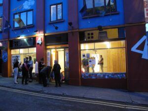 People outside Venue 4 at dawn